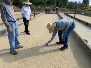 Checking the details on the bocce ball placement